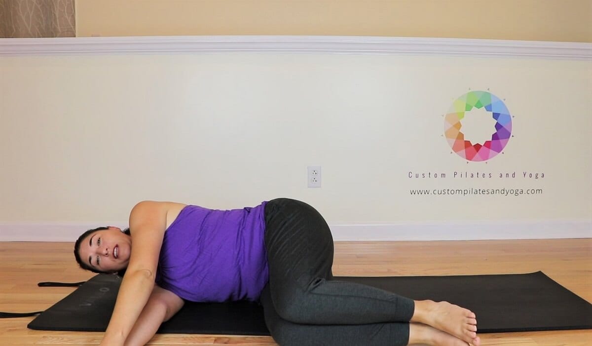 the starting position for pilates spinal rotation
