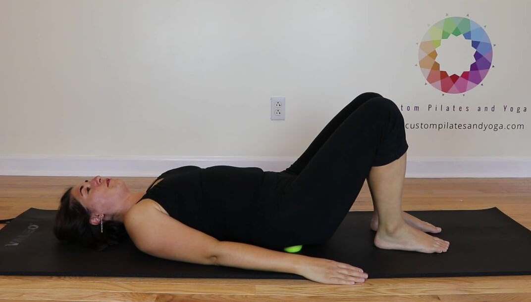 lying on dead tennis balls for glute pain relief